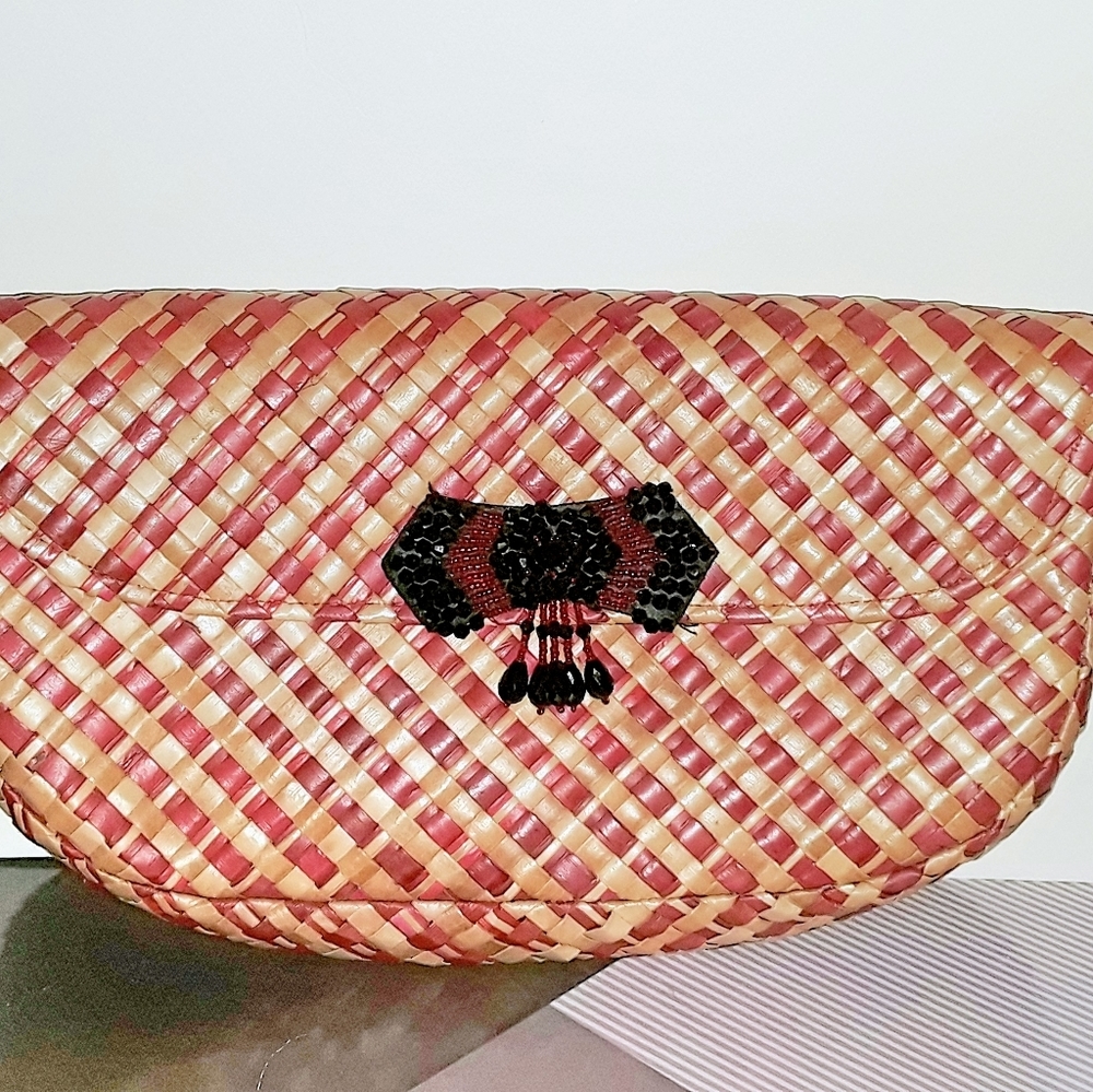 Woven straw clutch with fancy closure